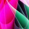 Vibrant abstract image featuring overlapping pink, green, and black curved paper designs.